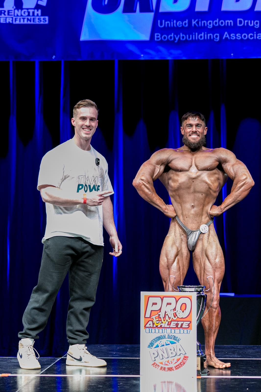 Champion bodybuilder posing on stage