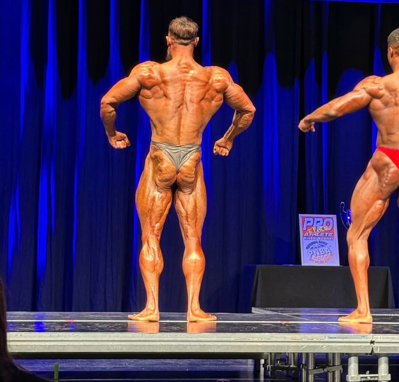 Bodybuilder posing on stage